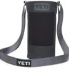 YETI Rambler Bottle Sling Charcoal Large -Fishing Specialty Store YETI Rambler Bottle Sling Charcoal Large SKU 0420 CHALGE 190948 st bernard website assets fall 19 studio f empty with strap in f 1680x1024 1024x1024@2x